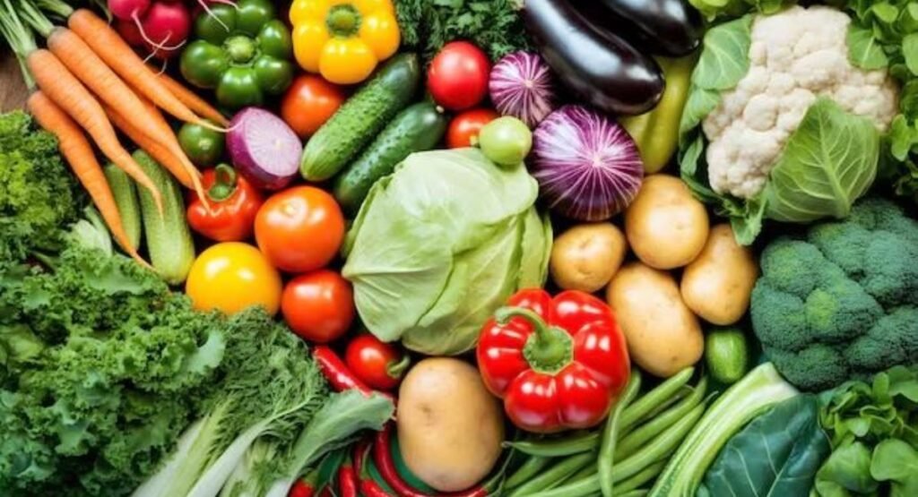 Fresh fruits, vegetables, grains, and eggs on a table