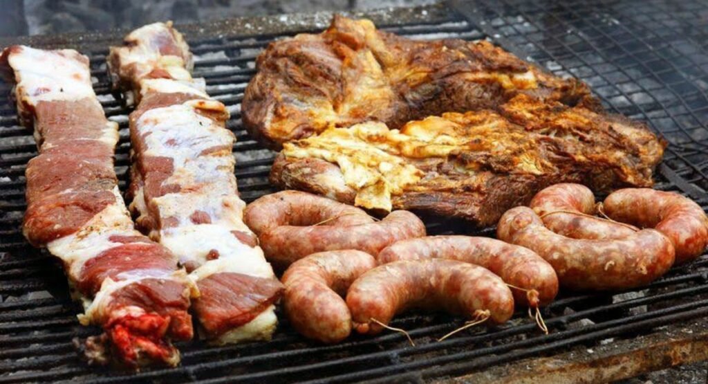 “Authentic Argentinian asado being slow cooked over charcoal.”