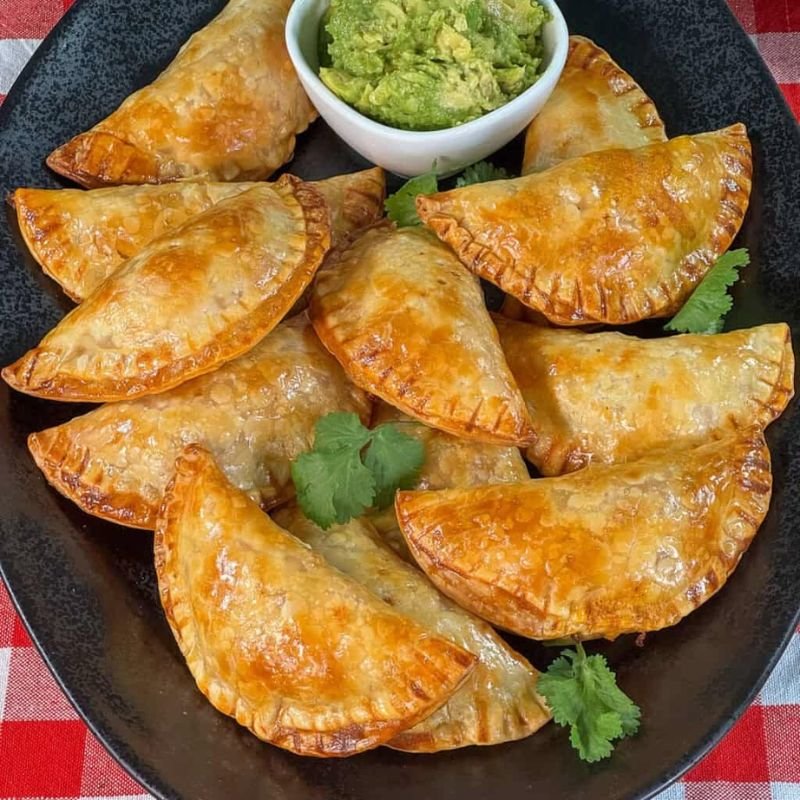Crispy Colombian empanadas served with spicy aji sauce
