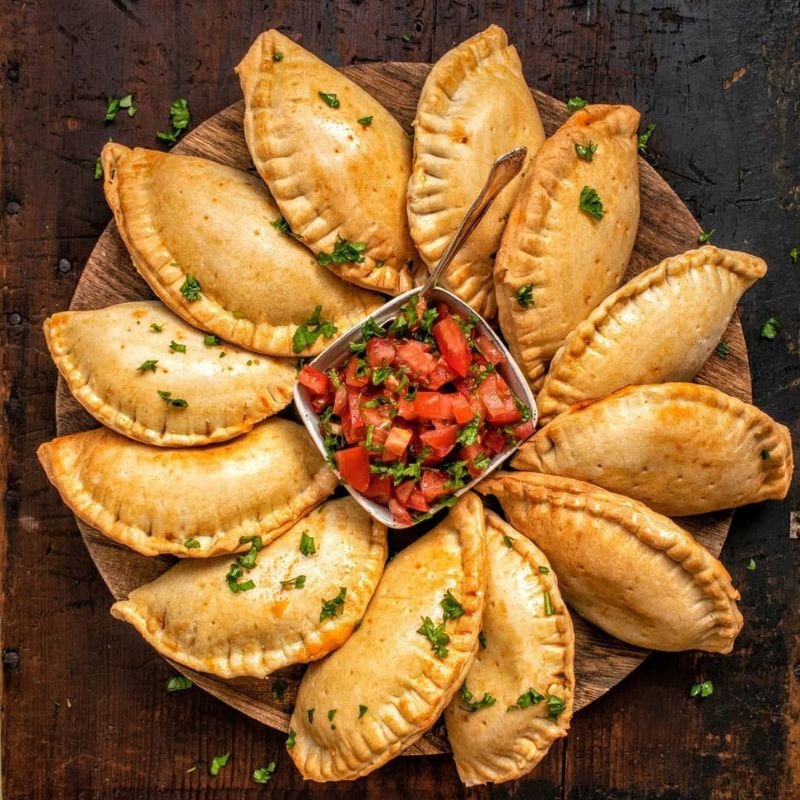 “Golden baked Argentinian empanadas filled with seasoned beef.”